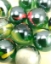 Picture of M244 25MM transparent green with colored swirls glass marbles